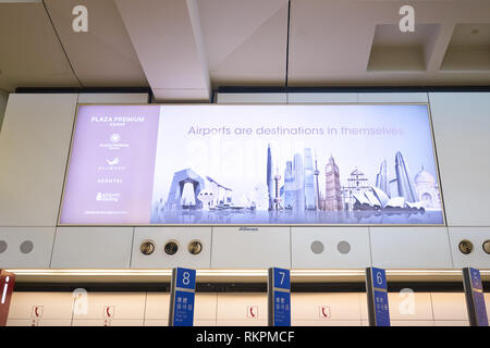 HONG KONG - 29 JANUARY, 2016: advertisement at Hong Kong International Airport. Hong Kong International Airport is the main airport in Hong Kong. Stock Photo