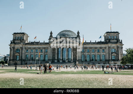 Germany, Berlin, September 05, 2018: Locals and tourists near the Reichstag building in Berlin. Sightseeing and ordinary city life. Stock Photo