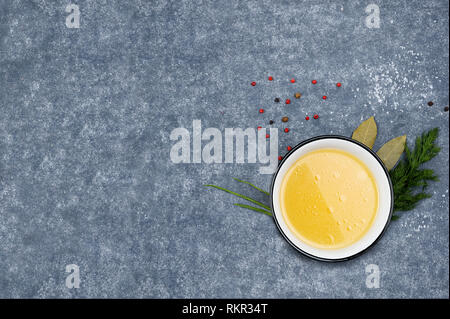 Creative layout made of broth on grey background. Rich in protein, specifically gelatin and minerals like calcium and phosphorus.Food concept. Image w Stock Photo