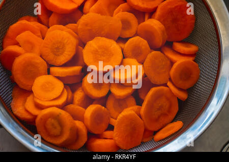 Carrots cut in a colander Stock Photo