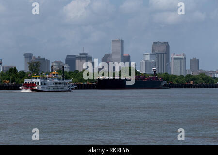 Gas carrier or gas tanker and tourist steamboat during navigation on the Mississippi river near New Orleans, Louisiana, United States of America Stock Photo