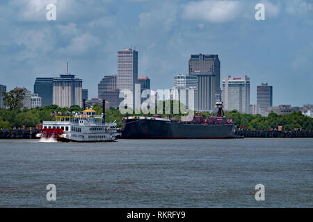 Gas carrier or gas tanker and tourist steamboat during navigation on the Mississippi river near New Orleans, Louisiana, United States of America Stock Photo