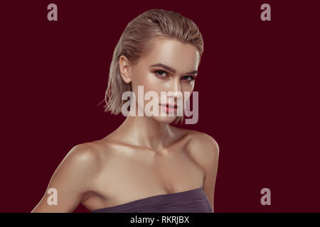 Young model with blonde short hair showing strong face Stock Photo