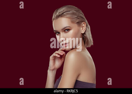 Young photo model with beautiful face posing for photographer Stock Photo