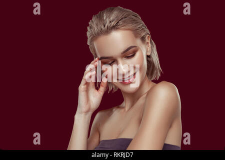 Young model with hair bob feeling cheerful and happy Stock Photo