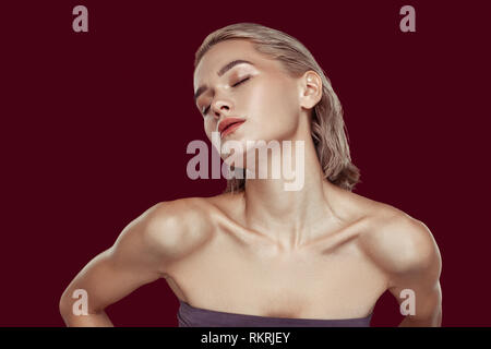 Blonde-haired model having sensitive feelings while posing Stock Photo