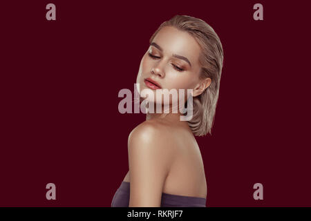 Blonde-haired woman with short blonde hair having nice makeup Stock Photo