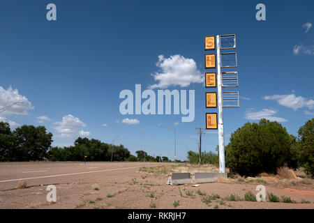 Abandoned Shell gas station on a US highway in Tucumcari, New Mexico, United States of America, along the iconic Route 66. View of a small American to Stock Photo