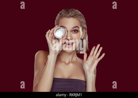 Blonde-haired woman showing funny face while posing Stock Photo