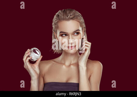 Blonde-haired beautiful woman with bob promoting cosmetics Stock Photo