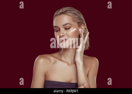 Young female beauty blogger promoting famous cosmetics Stock Photo