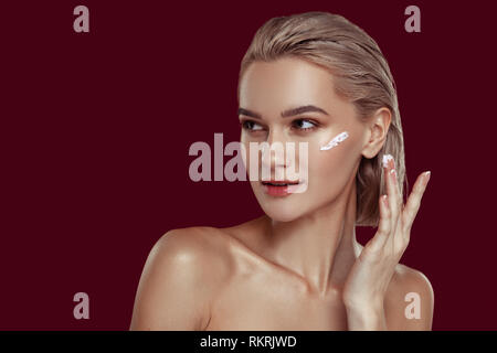 Close up of photo model feeling busy while promoting cosmetics Stock Photo