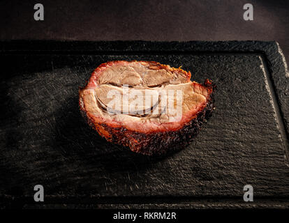 Spare rib on black slate cutting board Stock Photo
