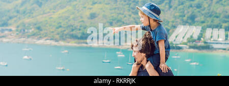 Father and son in the background of Promthep cape and Yanui beach. Phuket, Thailand. Traveling with children concept BANNER, long format