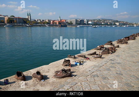 The 'Shoes on the Danube Bank', Budapest, Hungary. The trail of iron shoes is a memorial to Hungarian Jews shot here by Arrow Cross militiamen in WW2. Stock Photo