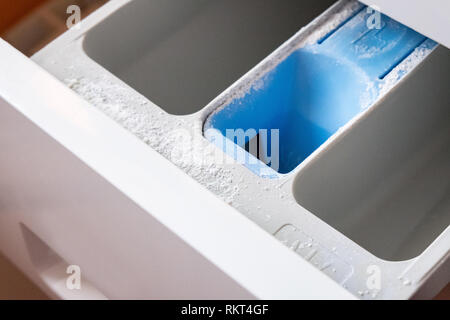 Powder compartment in the washing machine. Side view. Light photo Stock Photo