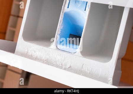 Powder compartment in the washing machine. Side view. Light photo Stock Photo