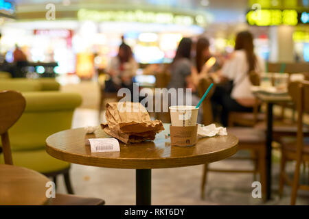 SINGAPORE- SEPTEMBER 12, 2016: Starbacks at Changi Airport in Singapore. Starbucks Corporation is an American coffee company and coffeehouse chain. Stock Photo