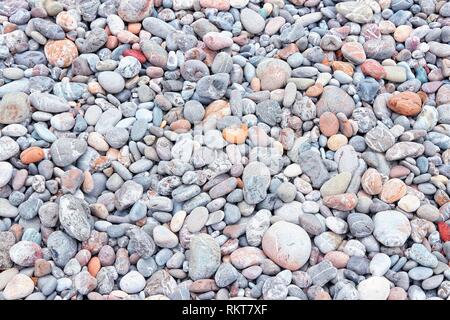 Pebbly beach background from Crete, Greece. Shingle beach. Stock Photo