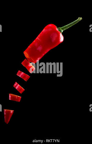 Creative concept with flying vegetables on an black background. Levity vegetable with water drops Stock Photo