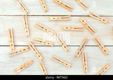 Wooden clothes pegs on wooden background. Zero waste Stock Photo