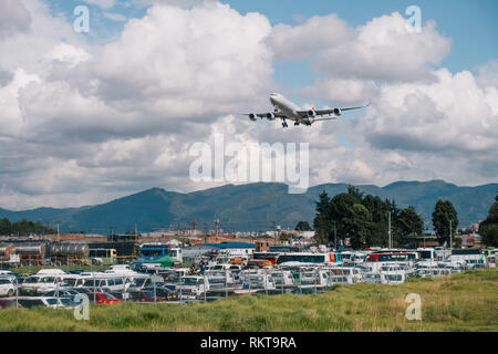 An Iberia Airbus A340-600 from Madrid approaches Bogotá El Dorado's runway 31R on a windy afternoon Stock Photo