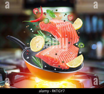 Grill pan with delicious salmon steaks on stove in kitchen Stock Photo -  Alamy