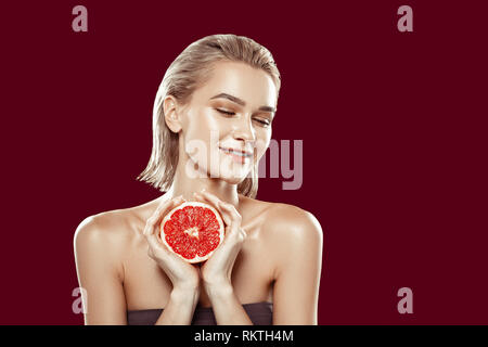 Model with nice natural makeup feeling joyful while posing Stock Photo