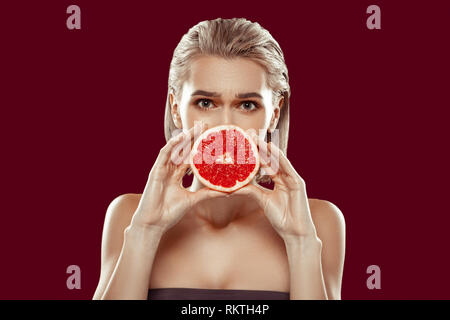 Blonde-haired model showing different emotions while posing Stock Photo