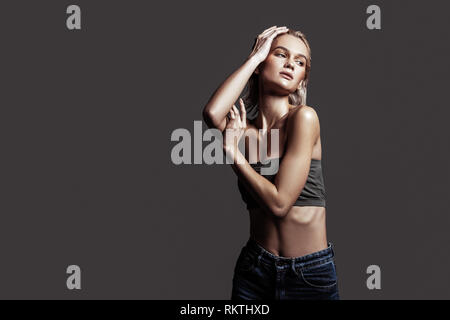 Slim model with nice abs showing nice poses for photographer Stock Photo