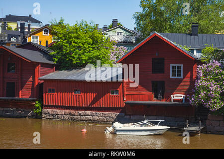 Traditional Finnish red wooden barns are on the river coast, Porvoo town, Finland Stock Photo