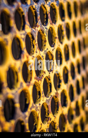 Rusty yelllow painted steel. Stock Photo