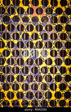 Rusty yelllow painted steel. Stock Photo