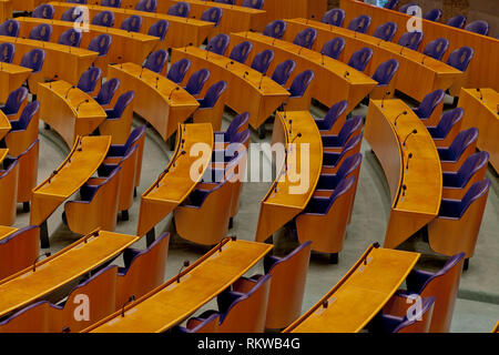 Interior detail of the empty plenary hall of the House of Representatives in The Netherlands with the chairs for the representatives Stock Photo