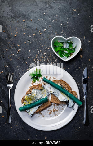 A meal of plastic waste on toast. Stock Photo
