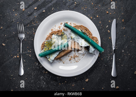 A meal of plastic waste on toast. Stock Photo
