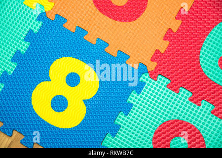 Colorful Baby Mat. Rubber foam pad for children playing. Colorful background ackground with digits. Stock Photo