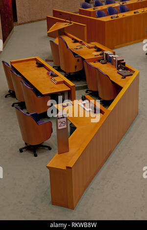 Interior detail of the empty plenary hall of the House of Representatives in The Netherlands with the location of the chairman or chairwoman Stock Photo