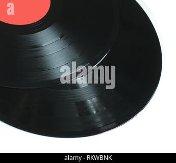 vinyl record of red color on a black background close-up Stock Photo