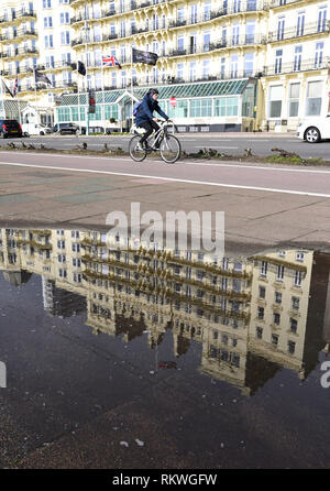 Brighton, UK. 12th Feb, 2019. A sunny day by the Grand Hotel on Brighton seafront as warmer weather is forecast to spread across the UK over the next few days with temperatures reaching the mid teens centigrade in some parts Credit: Simon Dack/Alamy Live News Stock Photo
