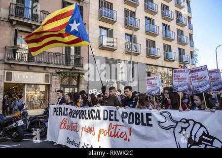 Barcelona, Catalonia, Spain. 12th Feb, 2019. A large pro-independence flag is seen in front of the student demonstration.Coinciding with the first day of trial of the Catalan political prisoners the student community has organized a day of solidarity General Strike under the slogan Republic for the people. Credit: Paco Freire/SOPA Images/ZUMA Wire/Alamy Live News Stock Photo
