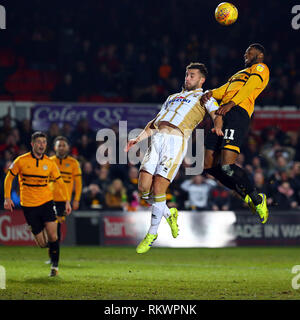 Newport, UK. 12th Feb, 2019. Jamille Matt of Newport County beats Baily Cargill of MK Dons during the EFL Sky Bet League 2 match between Newport County and Milton Keynes Dons at Rodney Parade, Newport, Wales on 12 February 2019. Photo by Dave Peters. Editorial use only, license required for commercial use. No use in betting, games or a single club/league/player publications. Credit: UK Sports Pics Ltd/Alamy Live News Stock Photo
