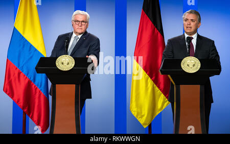 12 February 2019, Colombia, Bogotá: Federal President Frank-Walter Steinmeier (l) and Ivan Duque Marquez, President of Colombia, speak at a press conference after their talks at the President's office. Federal President Steinmeier and his wife are visiting Colombia and Ecuador on the occasion of Alexander von Humboldt's 250th birthday as part of a five-day trip to Latin America. Photo: Bernd von Jutrczenka/dpa Stock Photo