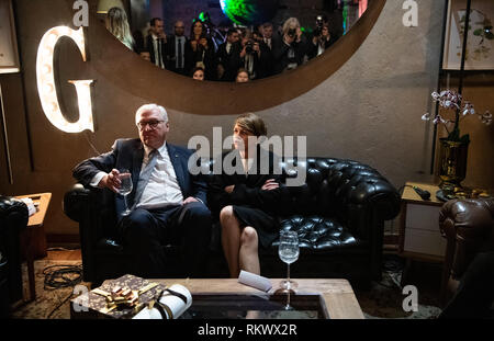 12 February 2019, Colombia, Bogotá: Federal President Frank-Walter Steinmeier and his wife Elke Büdenbender (r) are sitting at a reception in the restaurant 'Padre'. Federal President Steinmeier and his wife are visiting Colombia and Ecuador on the occasion of Alexander von Humboldt's 250th birthday as part of a five-day trip to Latin America. Photo: Bernd von Jutrczenka/dpa Stock Photo