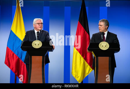 12 February 2019, Colombia, Bogotá: Federal President Frank-Walter Steinmeier (l) and Ivan Duque Marquez, President of Colombia, speak at a press conference after their talks at the President's office. Federal President Steinmeier and his wife are visiting Colombia and Ecuador on the occasion of Alexander von Humboldt's 250th birthday as part of a five-day trip to Latin America. Photo: Bernd von Jutrczenka/dpa Stock Photo