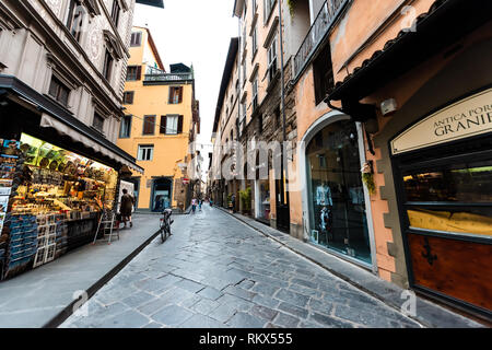 Florence, Italy - August 31, 2018: Building facade of shop store in Firenze, Italian city with sign and architecture in morning on Via Porta Rossa Stock Photo