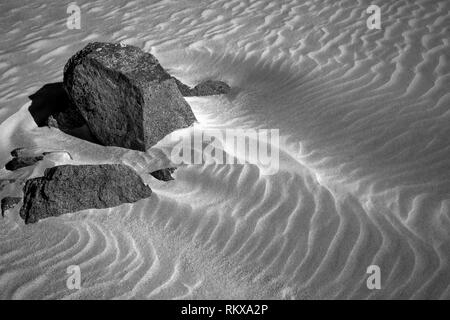 An Infrared image of beach sands on Corblets Bay on Alderney, Channel Islands. Stock Photo