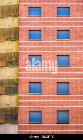 New building with blue blinds and net on the balconies in Malaga city, Spain Stock Photo
