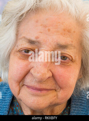 Lovely old lady smiling. Close view. Stock Photo