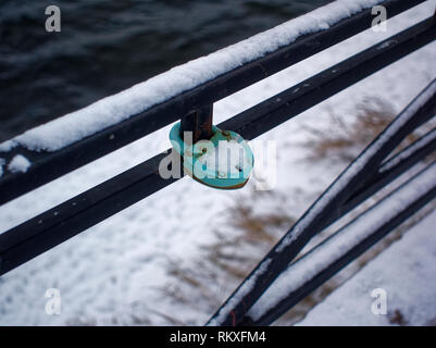 padlock on the fence of the bridge in winter, Moscow Stock Photo